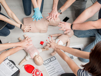 Demonstrating proper chest compression technique during CPR training.